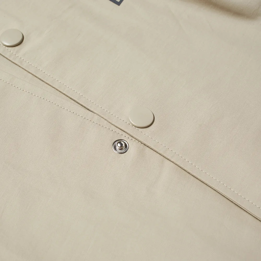 Fear of God Essentials Coach Jacket Sage